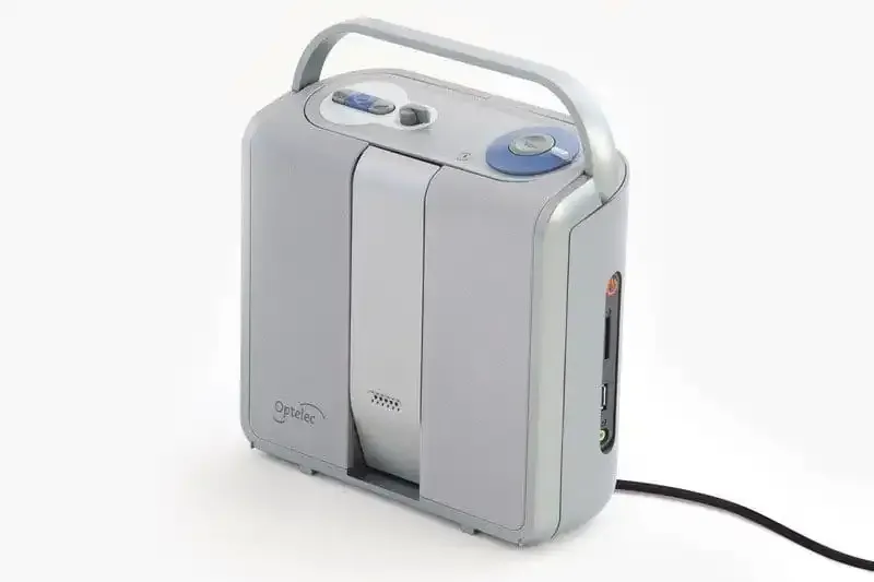Portable oxygen concentrator with carrying handle.